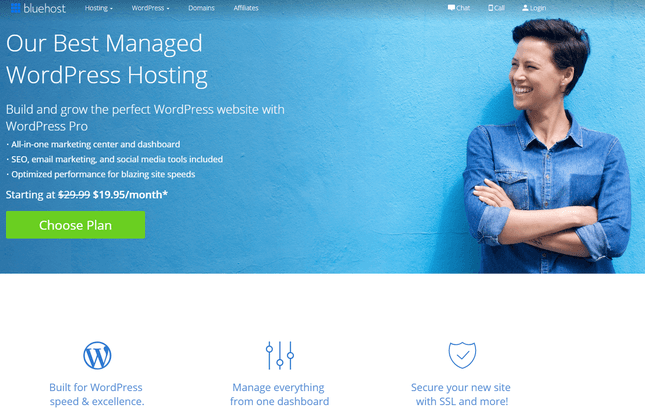 bluehost wordpress hosting page on lbue with smiling short-haired woman woth arms crossed